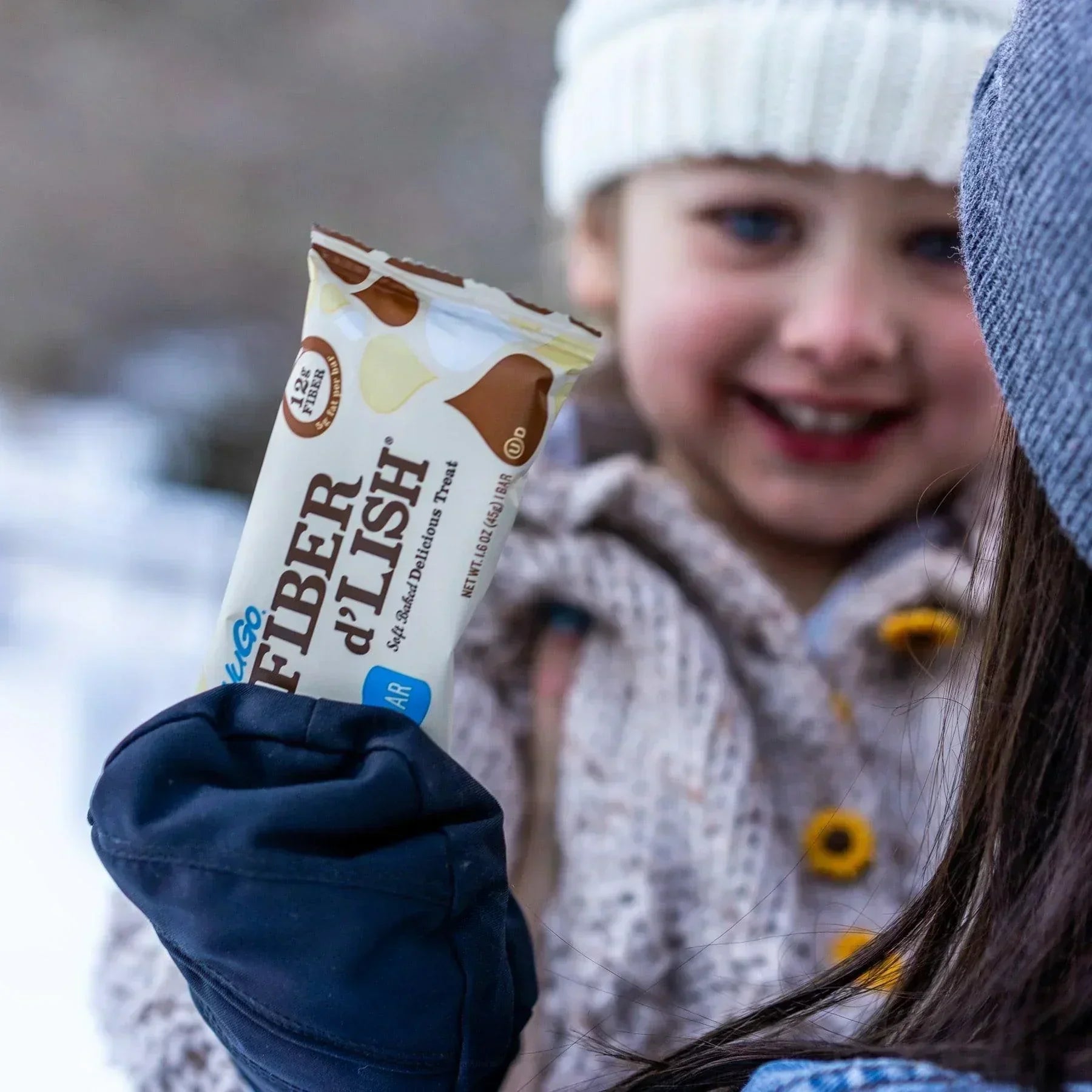 Small Child with nuGo Fiber dLish Blondie Bar