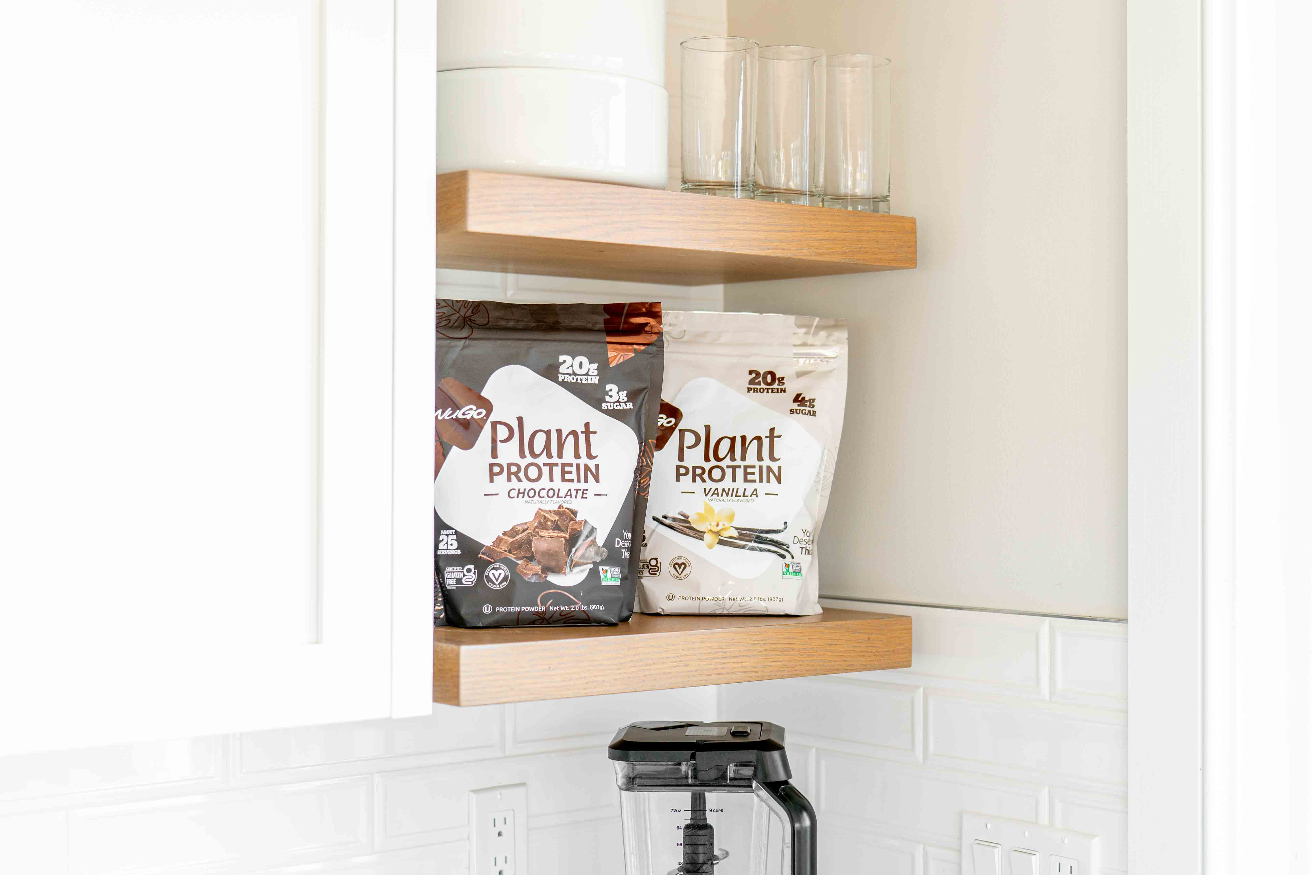 A bag of Chocolate and a bag of Vanilla Protein Powder on woooden shelf