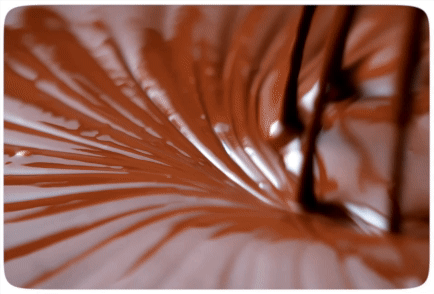 Chocolate being stirred with a Whisk
