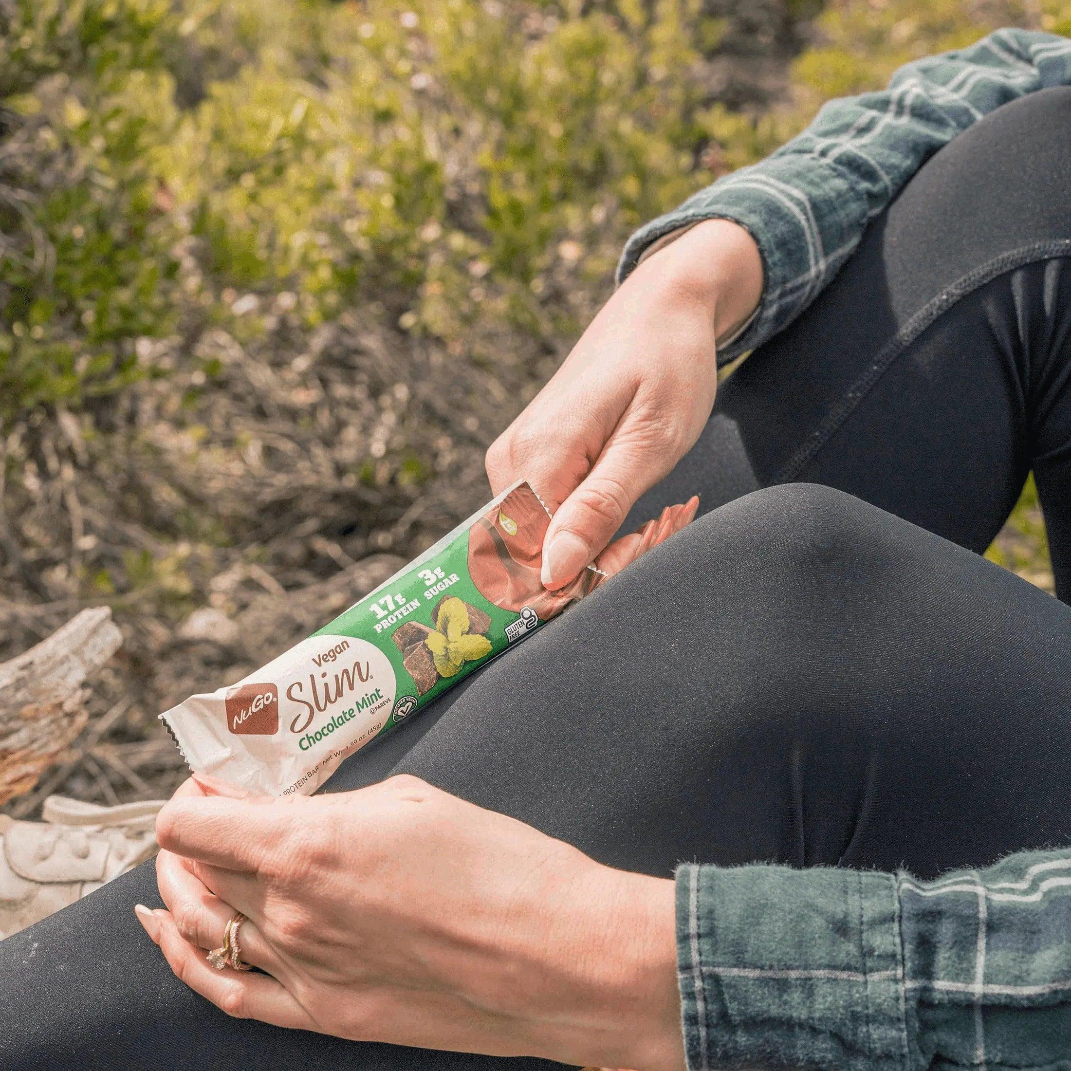Woman Hold NuGo Slim Chocolate Mint Bar