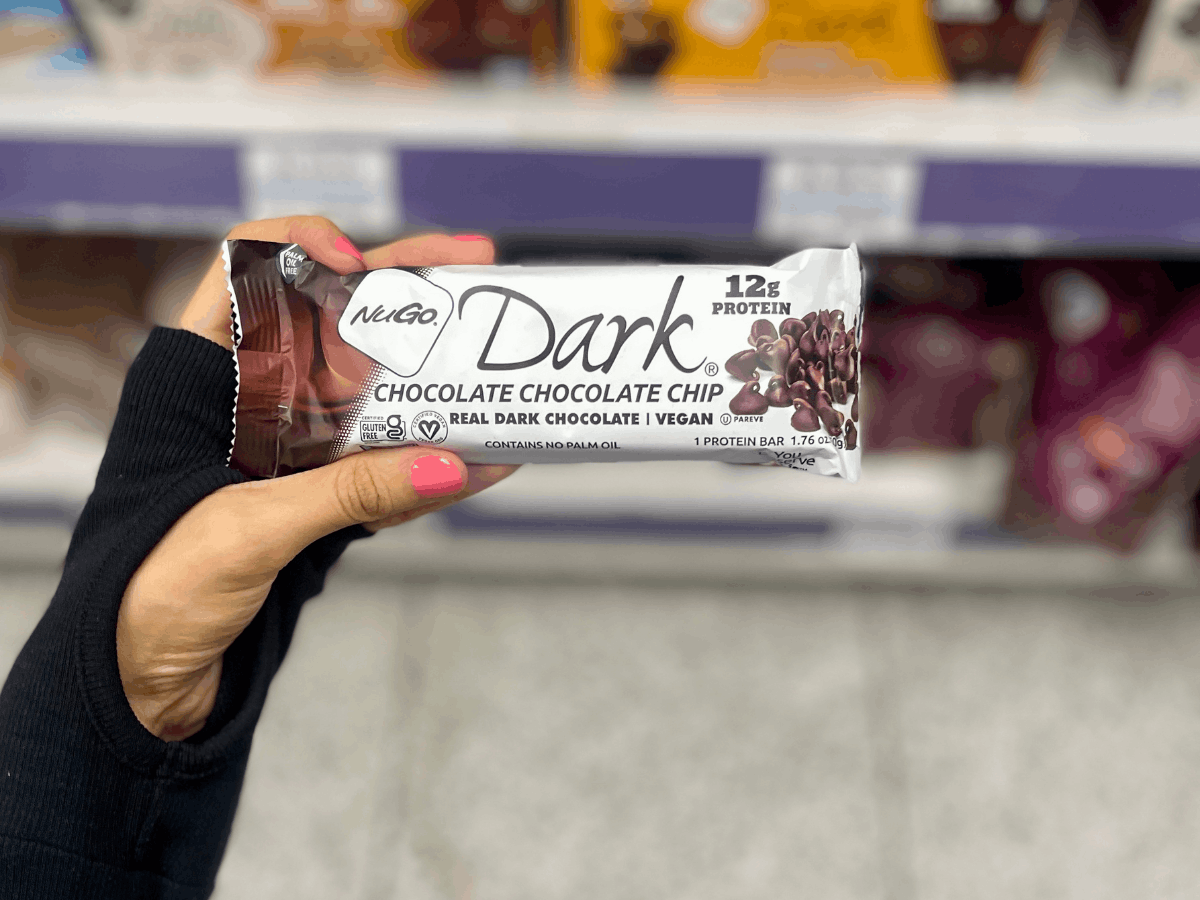 Woman's Hand holding a Dark Chocolate Chocolate Chip Bar
