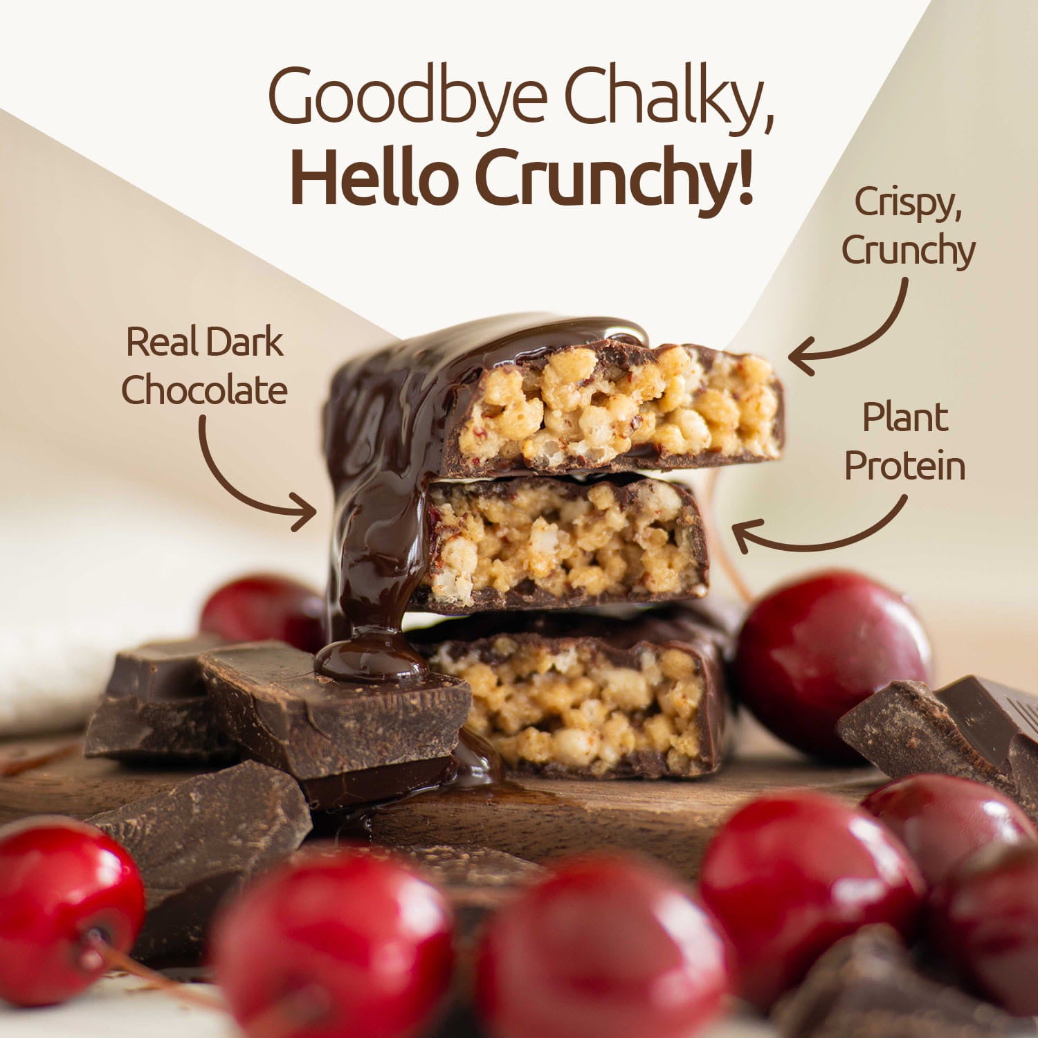 Dark chocolate bar with crumbly texture, surrounded by cherries and chocolate, on a light background.