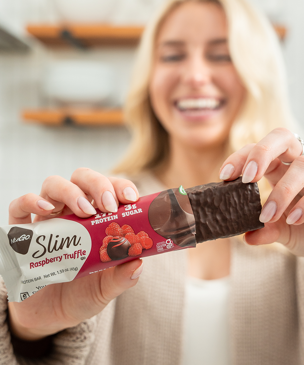Girl Holding NuGo Slim Bar
