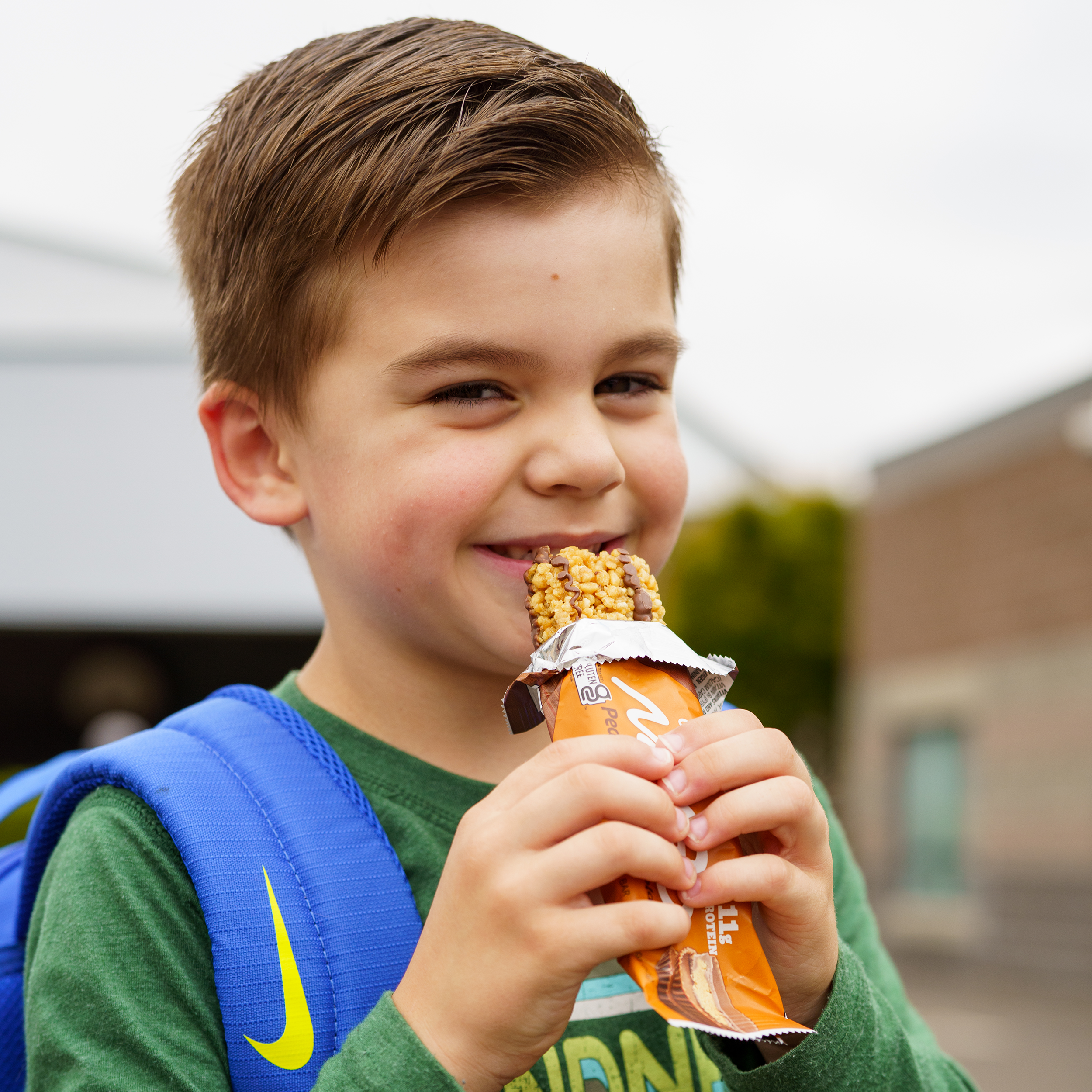 Young Boy eating NuGo Original Peanut Butter Chocolate