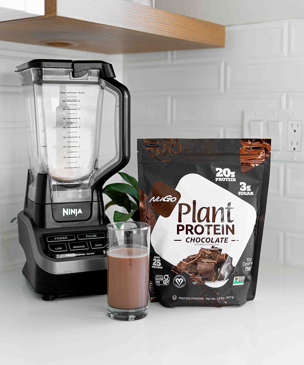 Chocolate Protein Powder next to blender